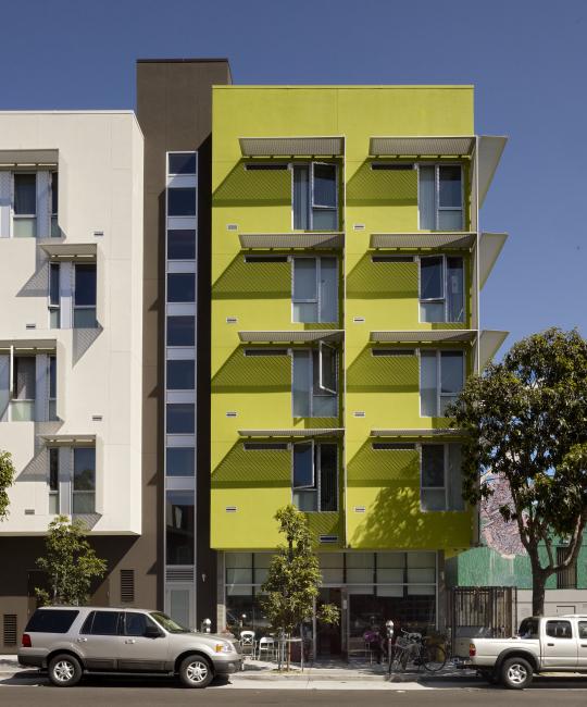 Detail of southwest corner of Richardson Apartments, bright green stucco bay