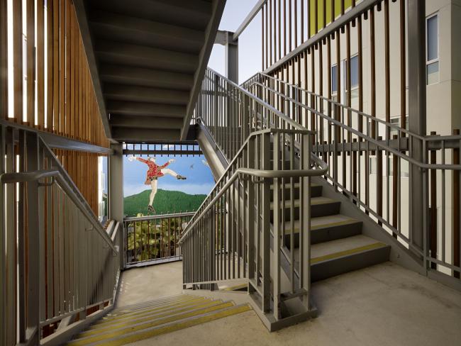 View from landing of open-air stair in the courtyard at Richardson Apartments