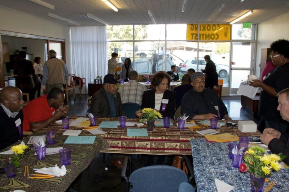 Group of people judging a cooking contest at Armstrong Place Senior in San Francisco.