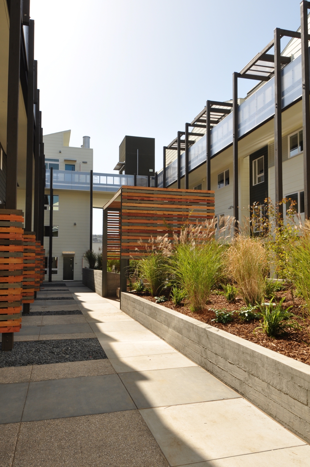 Courtyard with pergola seating areas at Armstrong Place in San Francisco.