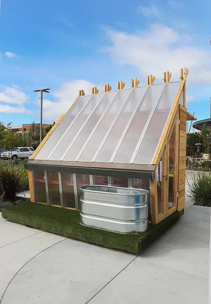 Farm to Table a wooden farmstand-inspired mini-greenhouse playhouse.
