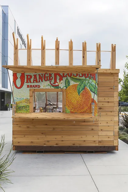 Farm to Table a wooden farmstand-inspired mini-greenhouse playhouse.