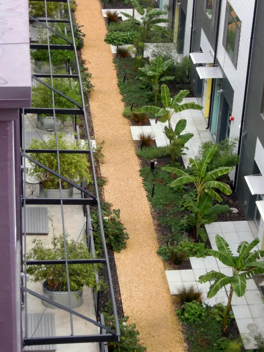 View of the resident pathway from above at Pacific Cannery Lofts in Oakland, California.