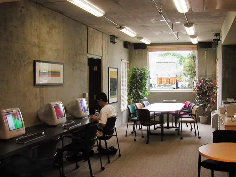 Resident using a computer at the community computer room Lenzen Square in San Jose, California.