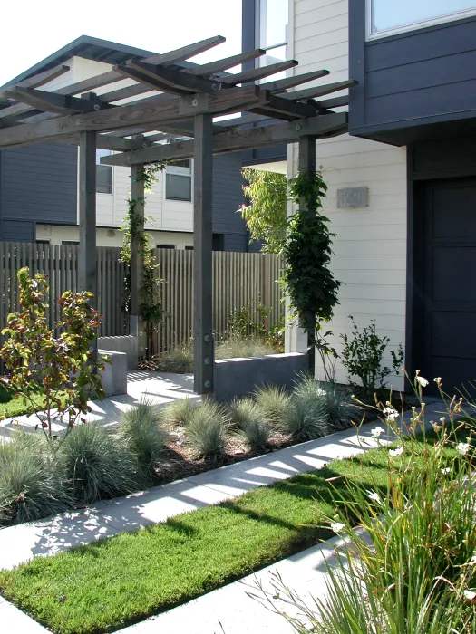 Trellis and driveway at a unit at Magnolia Row in West Oakland, California.