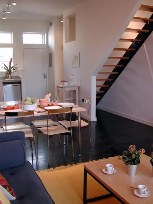 Ground level kitchen and living area inside a unit at Magnolia Row in West Oakland, California.