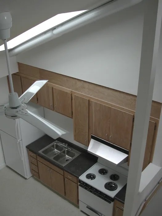 Kitchen inside of a unit at Folsom-Dore Supportive Apartments in San Francisco, California.