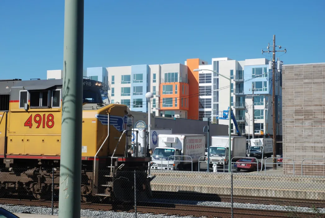 Exterior view of 200 Second Street in Oakland, California from across the train tracks.