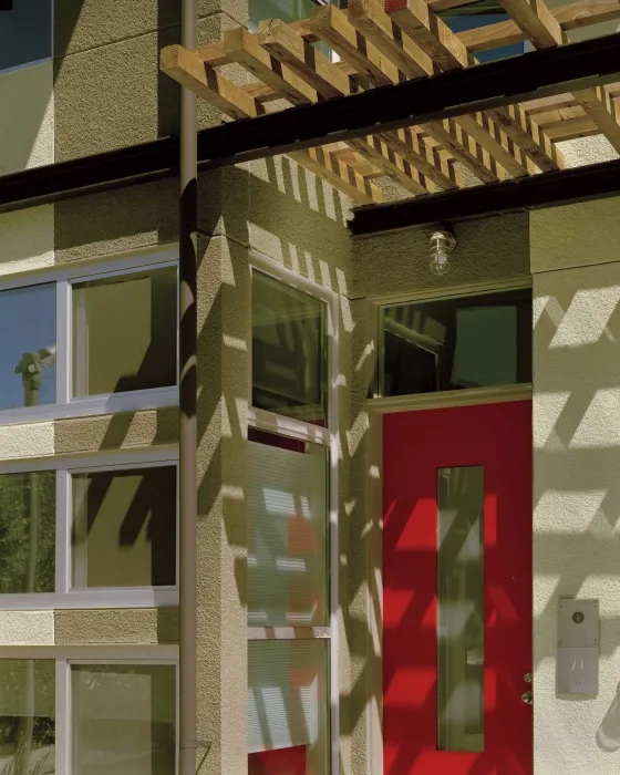 Red door of a townhome at West End Commons in Oakland, Ca.