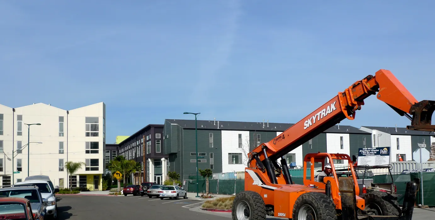 Blue skies with Pacific Cannery Lofts in Oakland, California in the distance.