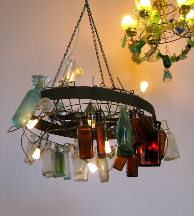 Chandelier made from different color glass bottles inside Taxi 2 in Denver, Colorado.