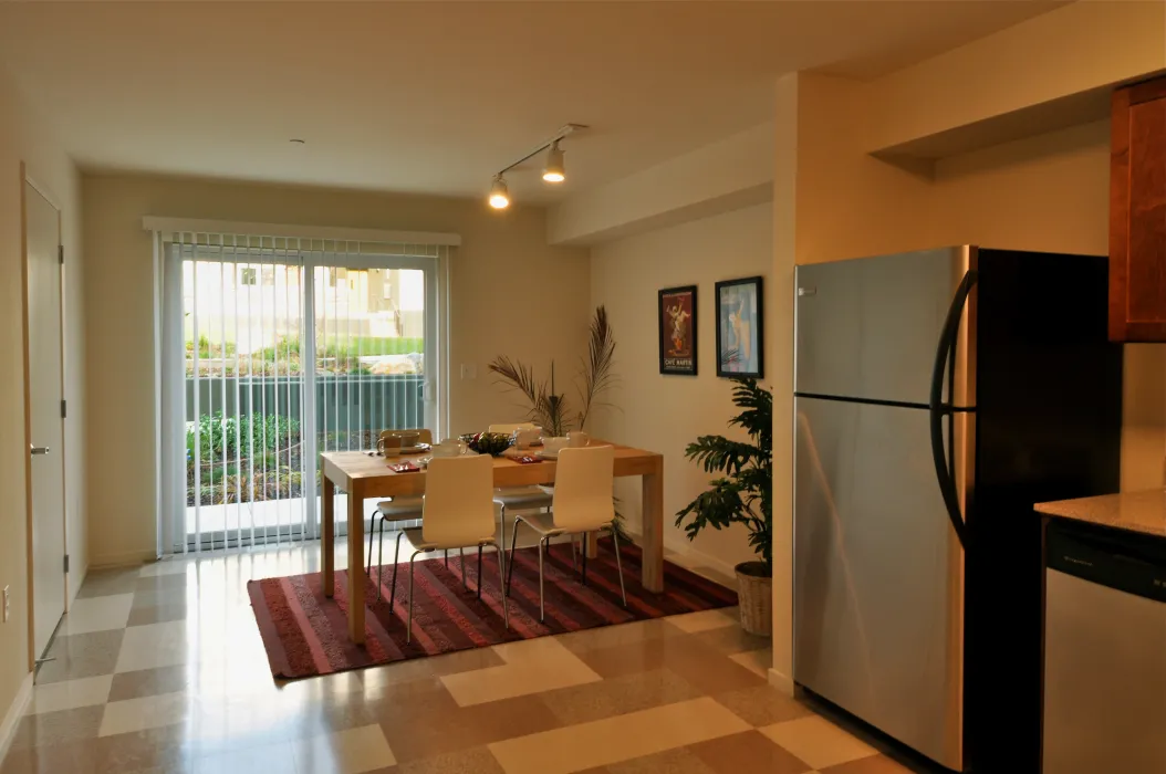 Kitchen and dining room inside a unit at Armstrong Place in San Francisco.