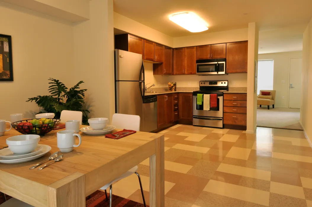 Dining room and kitchen inside a unit at Armstrong Place in San Francisco.