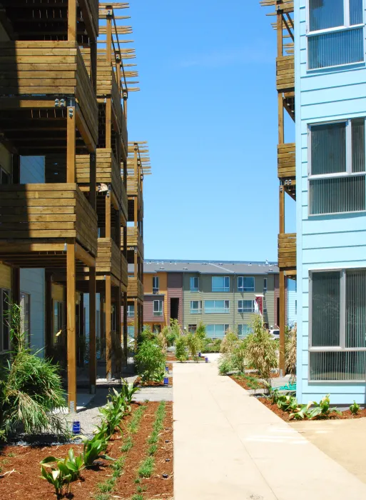 View of the townhouses through two apartment buildings at Crescent Cove in San Francisco.