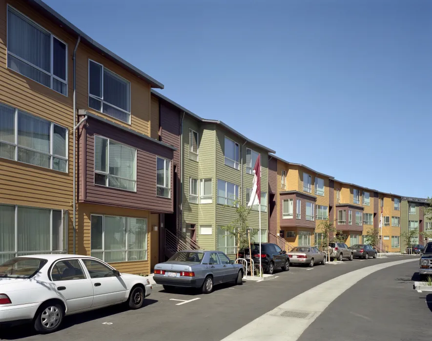 Curved row of townhouses in the private street at Crescent Cove in San Francisco.