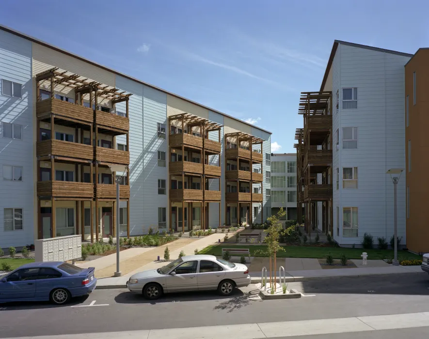 View of the residential courtyard at Crescent Cove from the curved street in San Francisco.