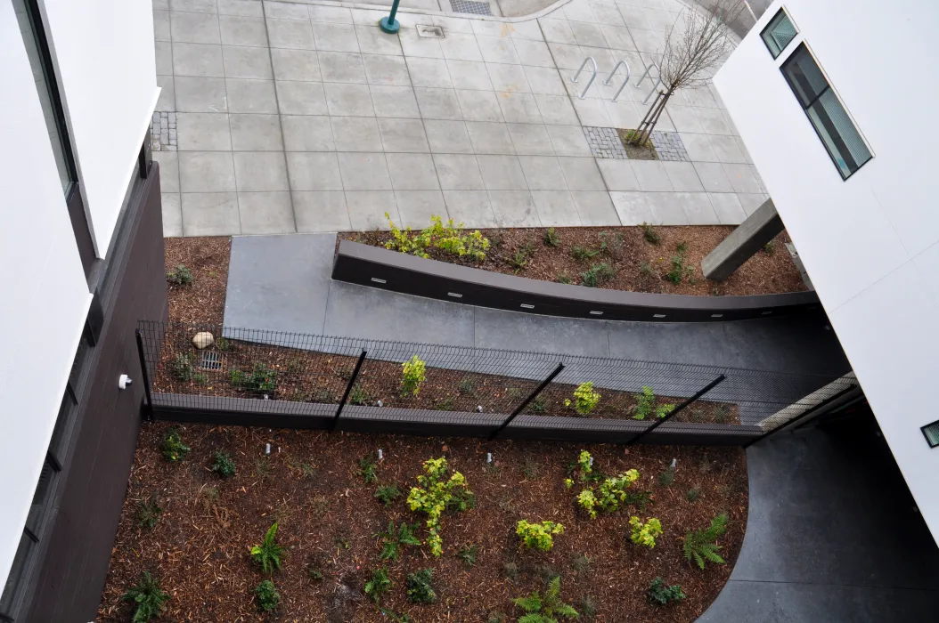 View of the entry court from above at Ironhorse at Central Station in Oakland, California.