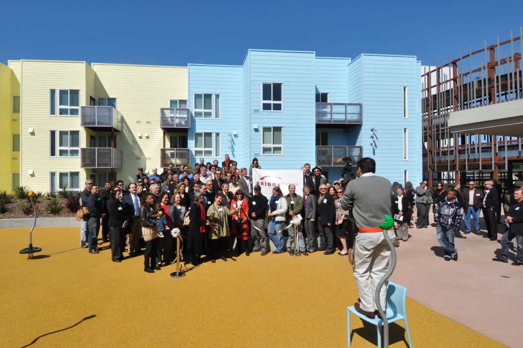 Group of people posing for a photo at Ironhorse at Central Station in Oakland, California.