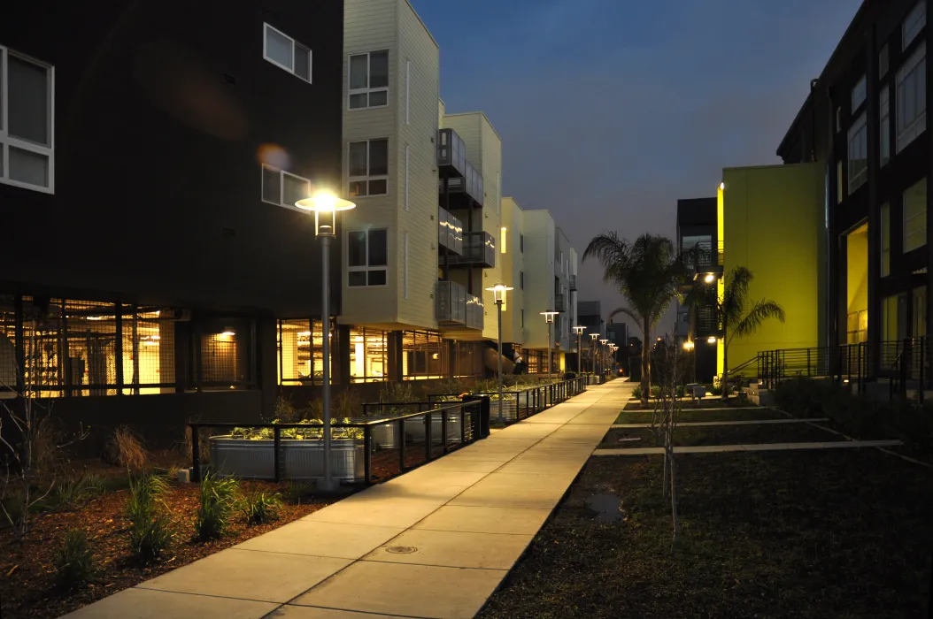 Exterior view dusk with Ironhorse at Central Station on the left and Pacific Cannery Lofts in Oakland, California.