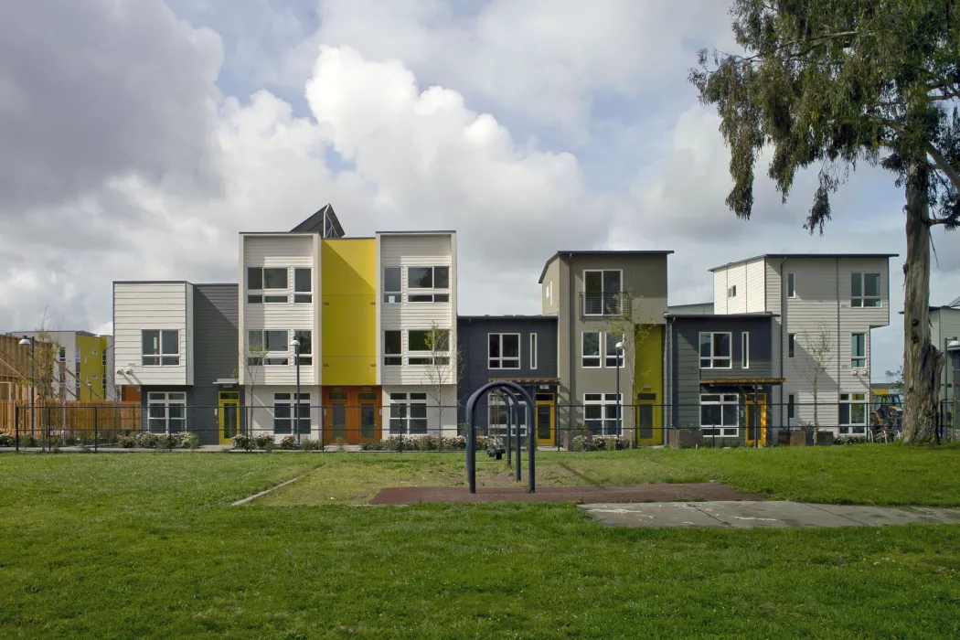View of townhouses from the public park at Tassafaronga Village in East Oakland, CA. 