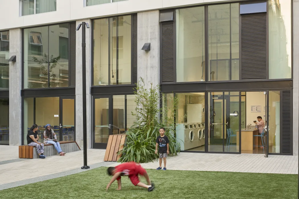 Children playing in the Courtyard of 222 Taylor Street, affordable housing in San Francisco