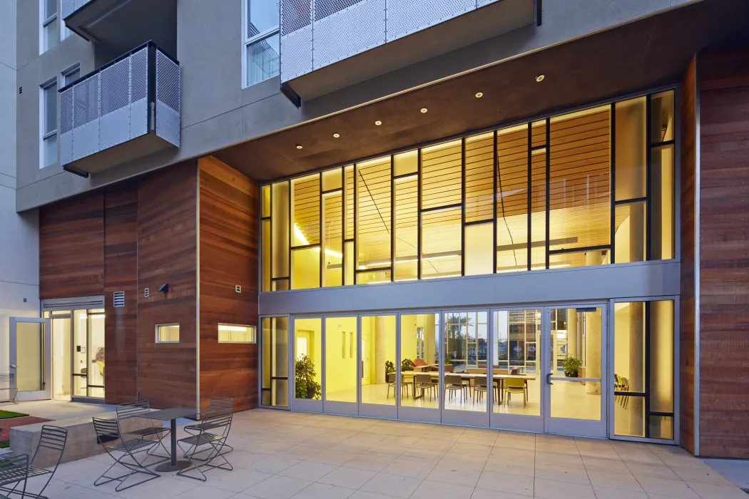 Looking into the community lounge from the courtyard at Station Center Family Housing in Union City, Ca.