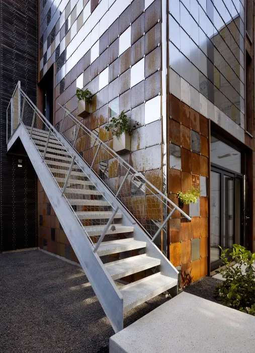 View of the outdoor metal stairs at Zero Cottage in San Francisco.