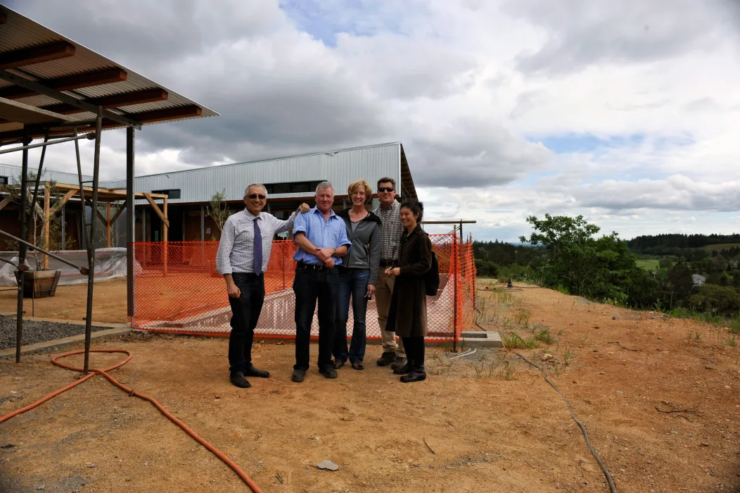 Four people standing in front of Healdsburg Rural House during construction.