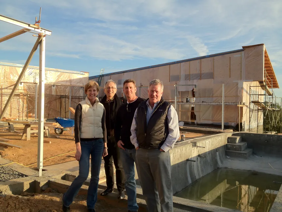 Four people standing in front of Healdsburg Rural House during construction.