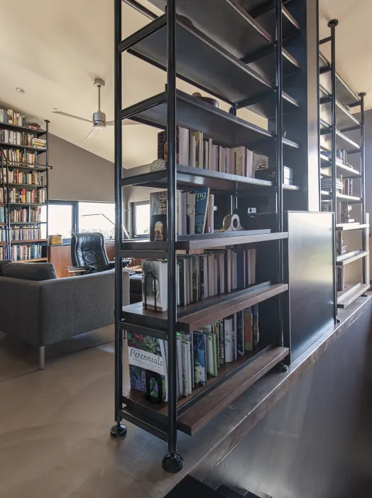 Bookshelf with downstairs showing in the corner inside Healdsburg Rural House in Healdsburg, California.