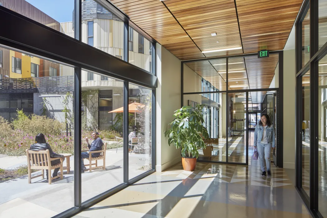 Hallway looking out into the courtyard inside Dr. George Davis Senior Building in San Francisco.