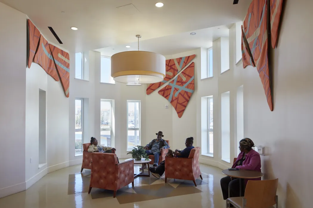 Resident sitting inside the Dr. George Davis Senior Building in San Francisco.