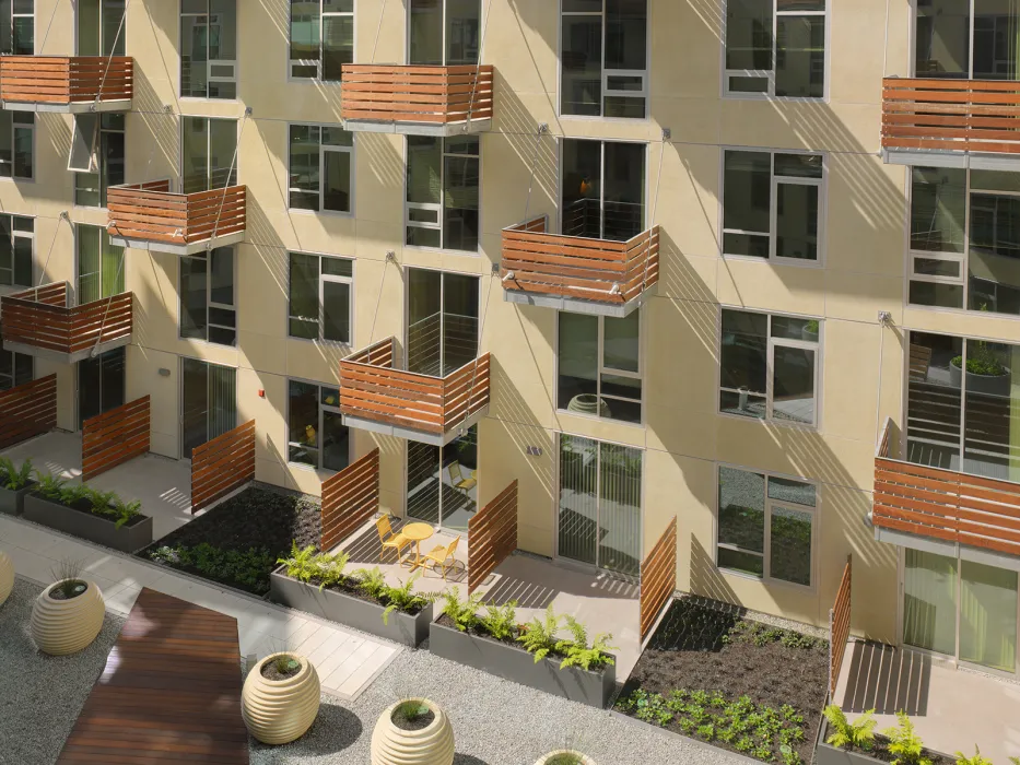 Wood balconies surrounding the courtyard at Rincon Green in San Francisco.