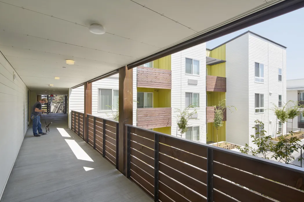 Exterior hallway view of Onizuka Crossing Family Housing in Sunnyvale, California.