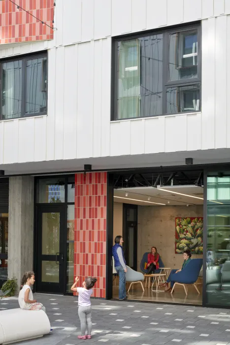 Courtyard connecting to the community room inside La Fénix at 1950, affordable housing in the mission district of San Francisco.