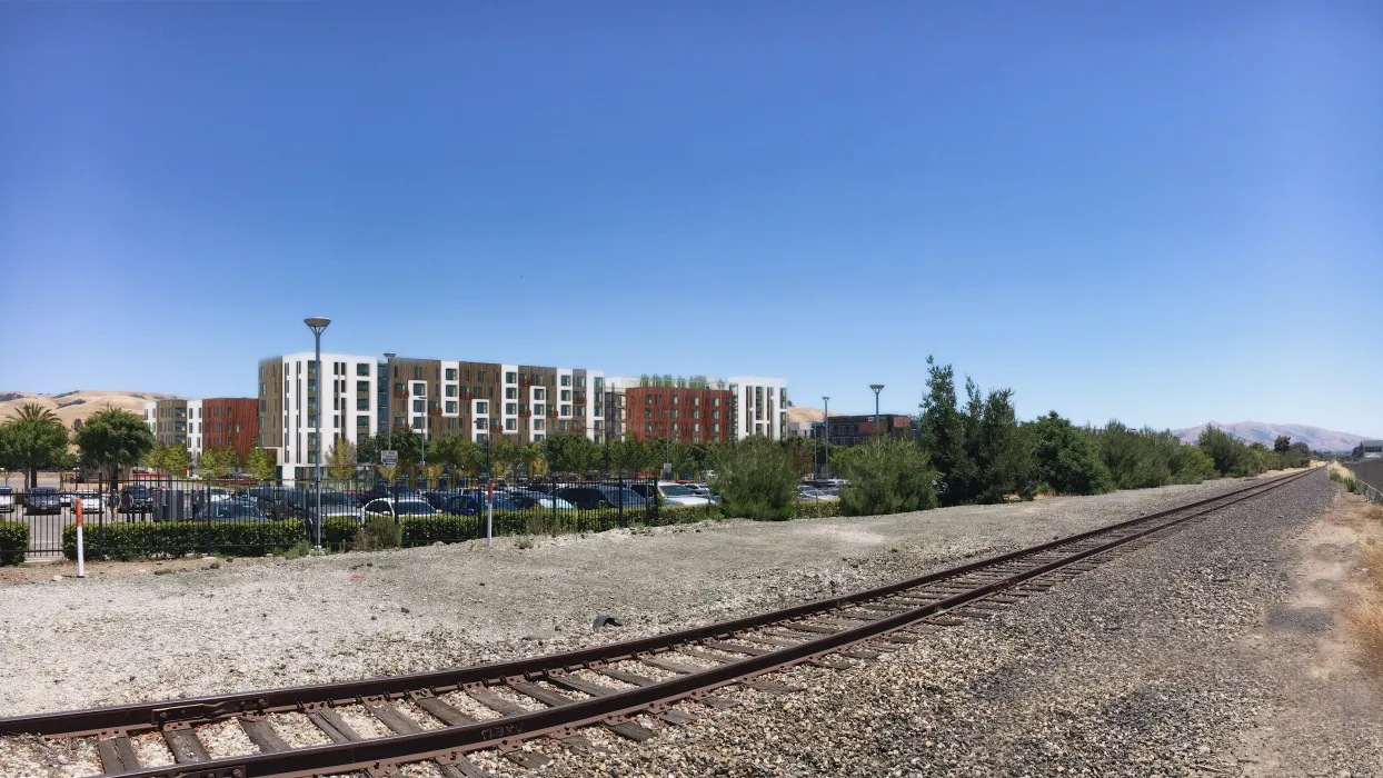 Exterior rendering of the South elevation across tracks, from Decoto Road and 12th Street at Windflower II in Union City, California.