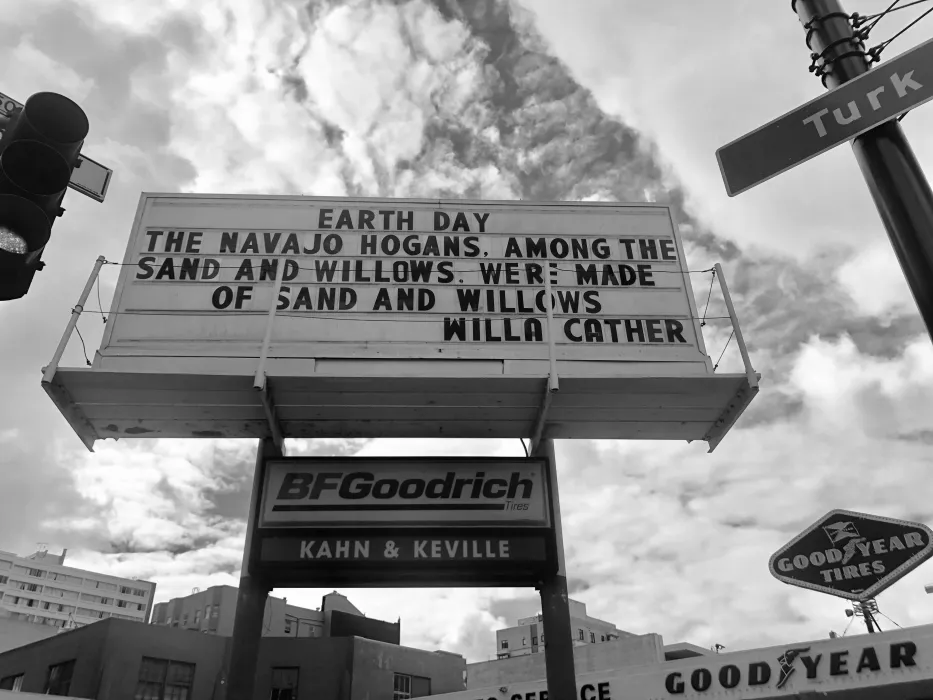 Sign at previous 555 Larkin site that states "Earth Day. The Navajo Hogans among the sand and willows were made of sand and willows. - Willa Carter"