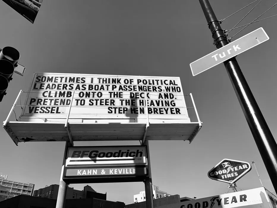 Sign at previous 555 Larkin site that states "Sometimes I think of political leaders as boat passengers who clim onto the deck and pretend to steer the heaving vessel. - Stephen Breyer"