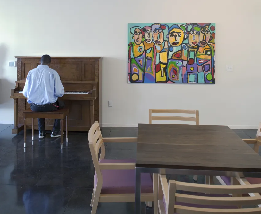 Man playing the piano at Armstrong Place Senior in San Francisco.