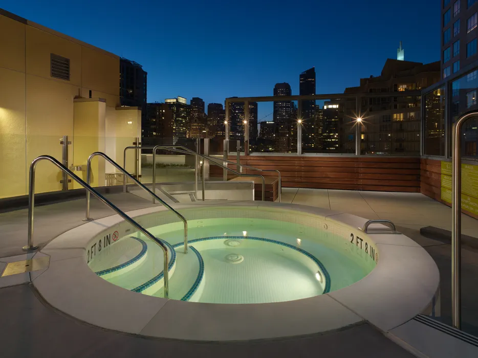 Hot tub on the roof of Rincon Green at dusk in San Francisco.