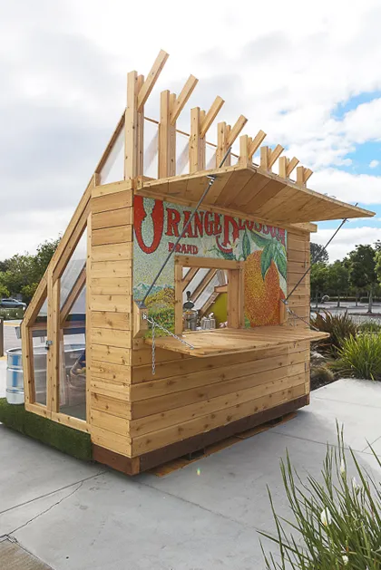 Farm to Table a wooden farmstand-inspired mini-greenhouse playhouse.