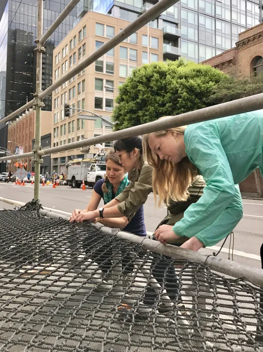 DBA Staff zip-tying net for Wishing Cloud.