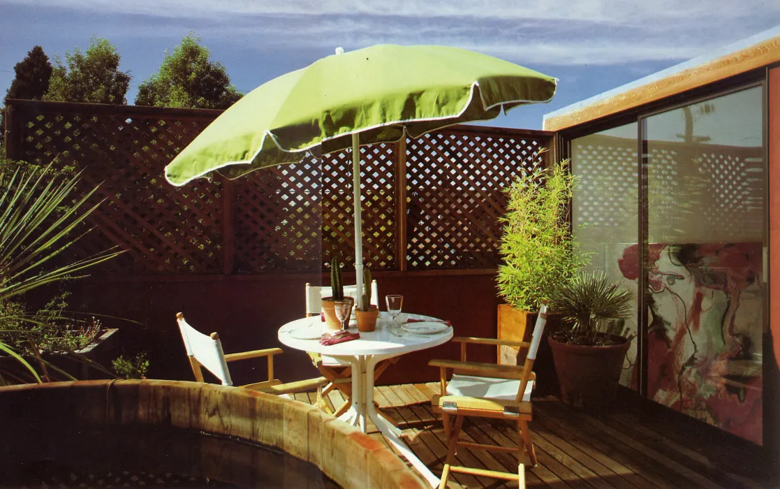 Outdoor umbrella and seating area on the deck of Spaghetti House in Berkeley, California.