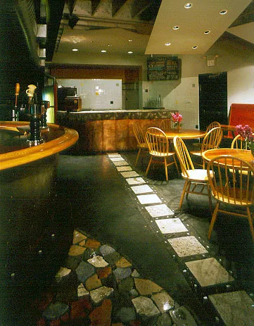 Downstairs bar and tables and chairs at Bison Building & Brew Pub in Berkeley, California.