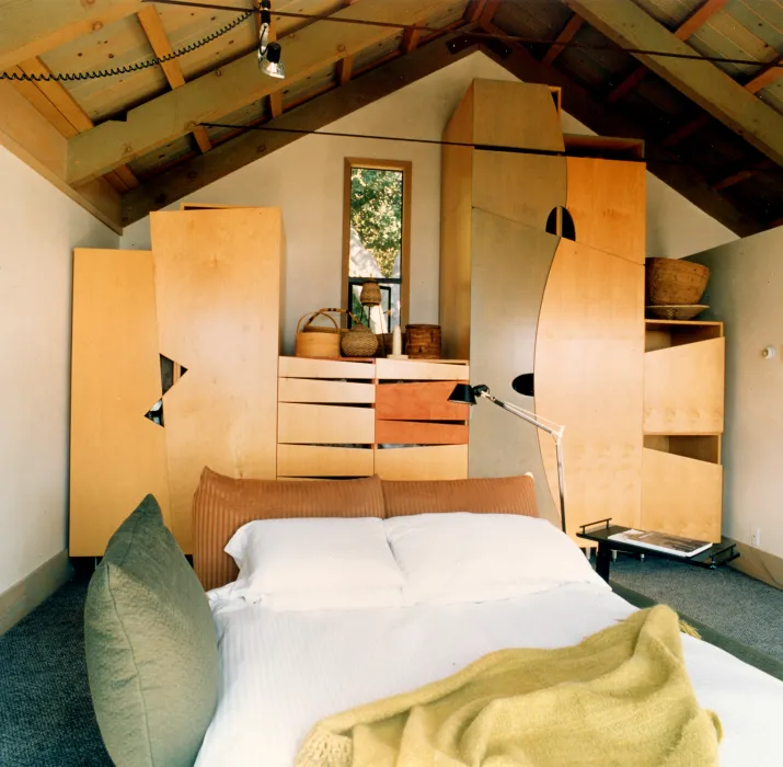 Custom stained-plywood wardrobe in the master bedroom at Revenge of the Stuccoids in Berkeley, California.