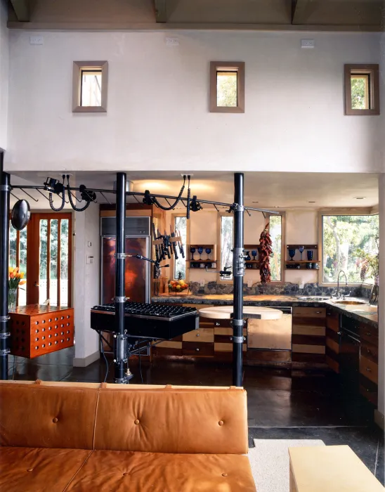 View of the kitchen from the living room inside of Revenge of the Stuccoids in Berkeley, California.