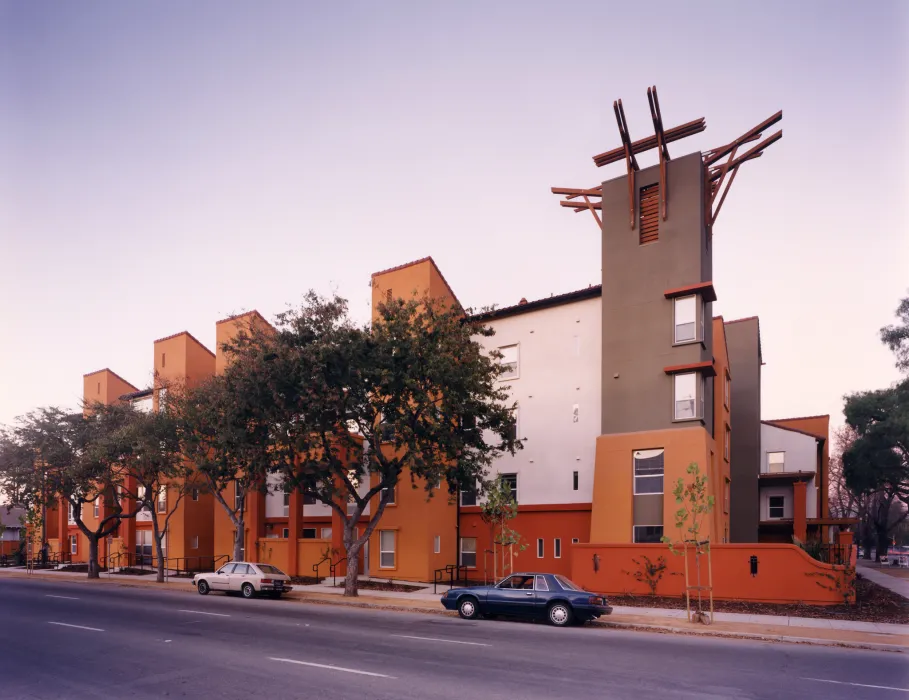 Exterior street view of Plaza Maria at sunset in San Jose, California.