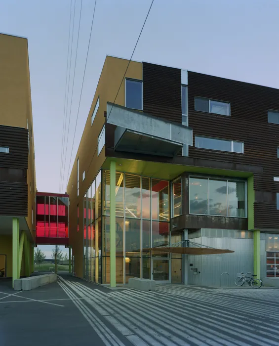 Exterior view of the entrance to Taxi 2 at dusk in Denver, Colorado. 