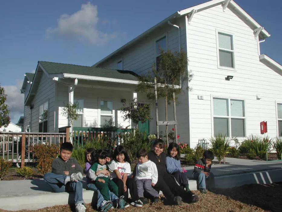 Children sitting at Moonridge Village in Santa Cruz, California.