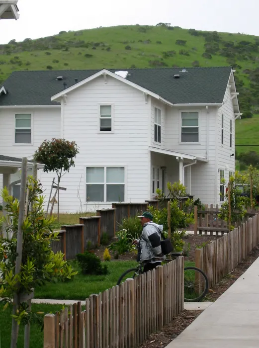 Resident walking with his bicycle at Moonridge Village in Santa Cruz, California.